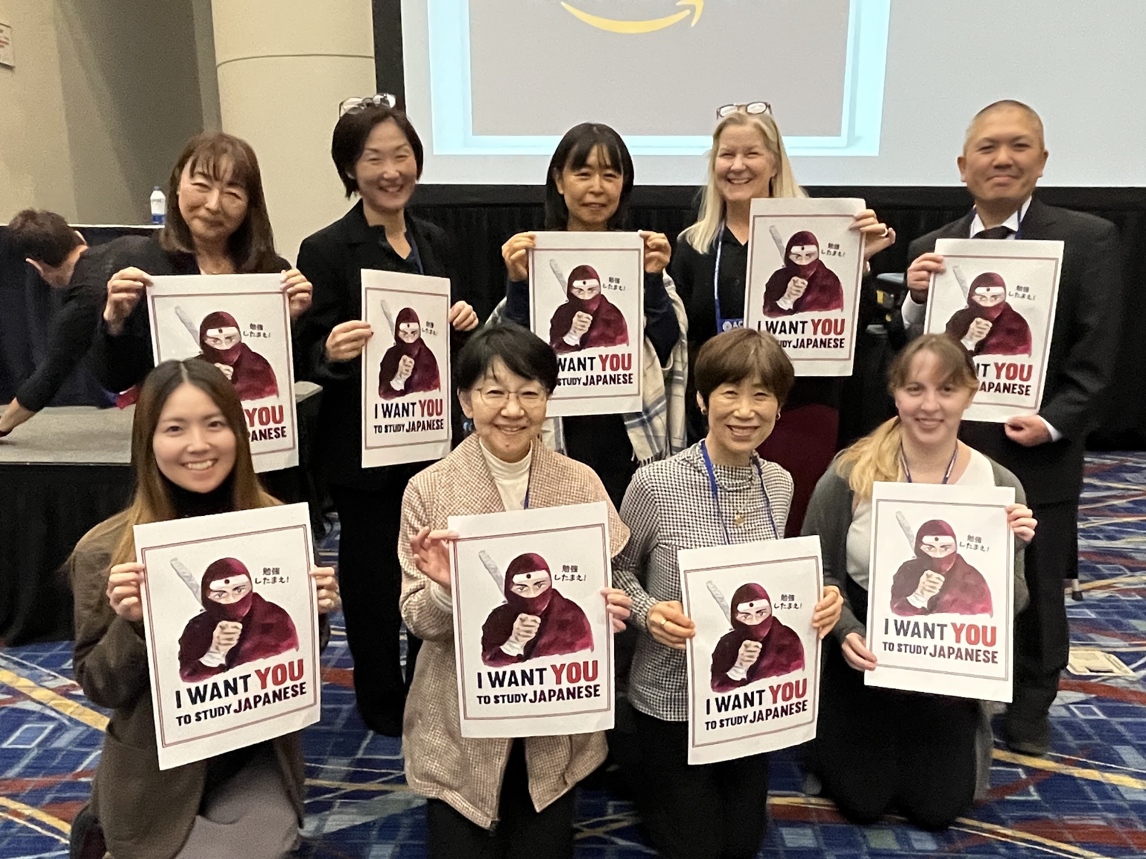 members at conference with posters